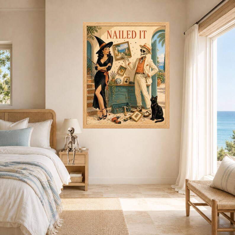 May include: A framed wall art print titled NAILED IT featuring a woman in a black dress and witch hat standing next to a skeleton wearing a beige suit and hat. A black cat sits on the floor near a blue cabinet with tools and framed pictures.