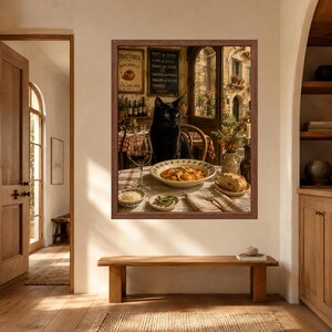 May include: A framed wall art print depicting a black cat sitting at a table set for a meal in an Italian trattoria. The table features a bowl of ravioli, a glass of red wine, bread, and small dishes. The background shows a rustic restaurant interior.