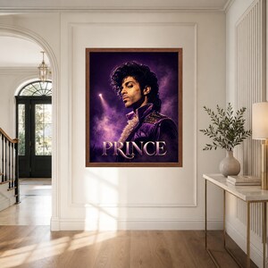 May include: A rectangular framed wall art print featuring a portrait of the musician Prince. The image shows Prince in a purple jacket with a ruffled collar against a dark purple smoky background with a spotlight. The word PRINCE is printed below.