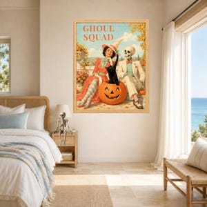 May include: A framed wall art print titled GHOUL SQUAD featuring a woman in a witch hat, a skeleton in a suit, and a black cat sitting in a carved jack-o'-lantern. The scene is set outdoors with orange autumn foliage and a distant landscape background.