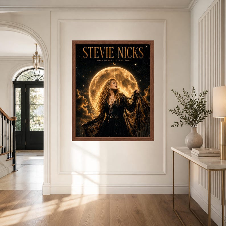May include: A framed wall art print featuring a portrait of Stevie Nicks in a black lace dress against a large, glowing full moon and starry night sky. The text STEVIE NICKS is printed in gold at the top, with WILD HEART GYPSY SOUL below it.