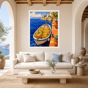 May include: A framed wall art print depicting a white boat filled with crates of bright yellow lemons floating on deep blue water. The scene includes a terracotta-colored stone pier, a lemon tree in a pot, and distant coastal buildings.