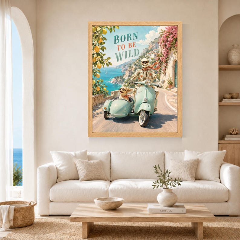 May include: A framed wall art print featuring a skeleton wearing sunglasses and a floral shirt riding a light blue scooter with a sidecar. A small dog sits in the sidecar. The text BORN TO BE WILD is printed above, with a coastal lemon grove background.