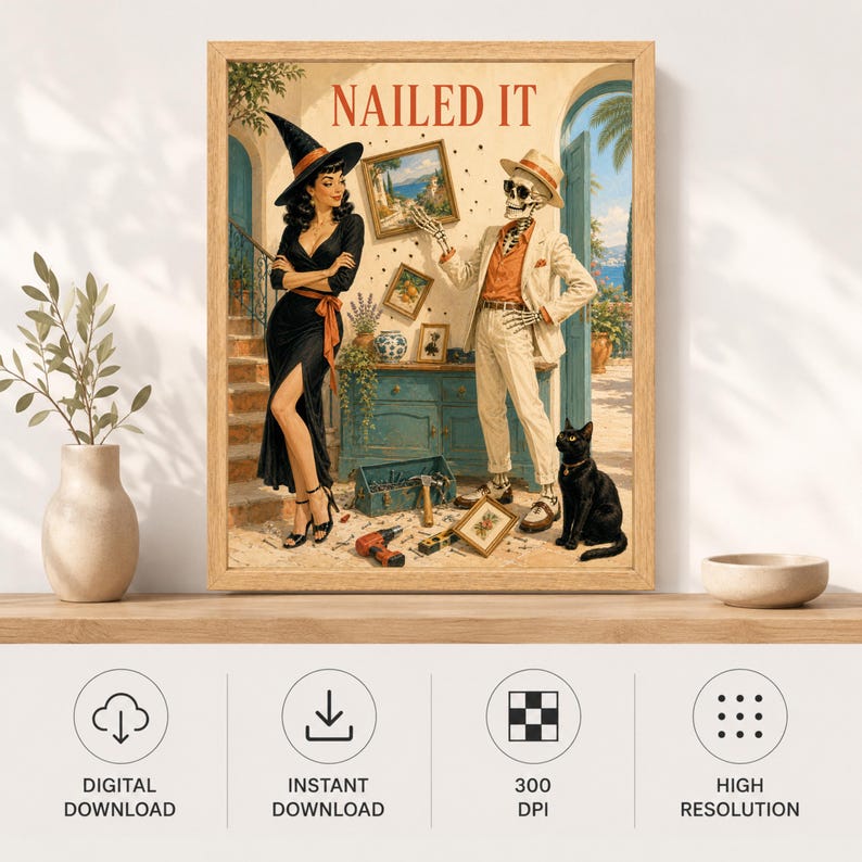 May include: A framed wall art print titled NAILED IT featuring a woman in a black witch hat and dress standing next to a skeleton wearing a beige suit and hat. A black cat sits nearby, and various tools are scattered on the floor in a room.