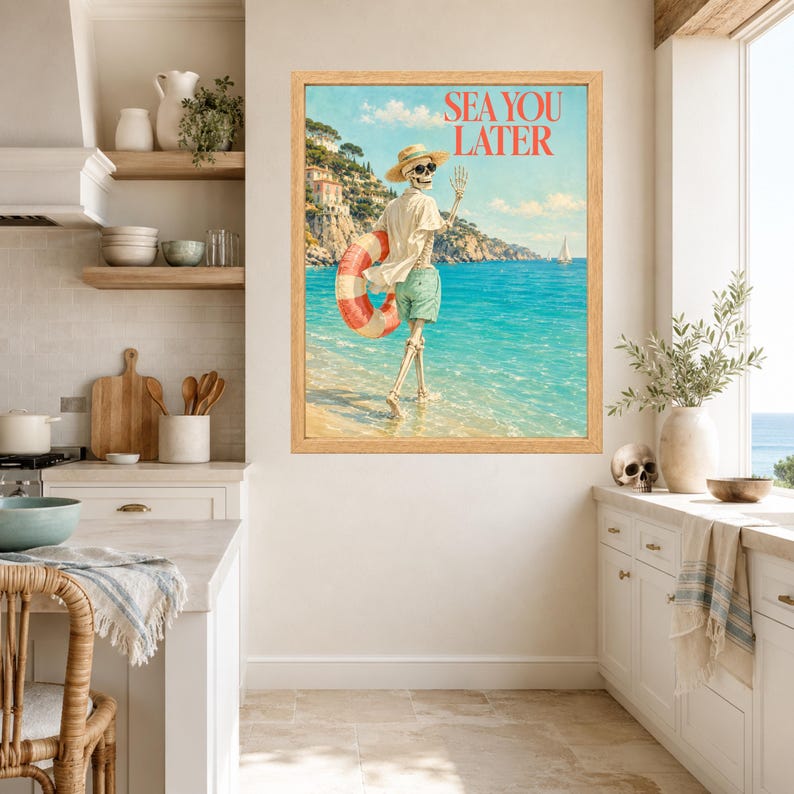 May include: A framed wall art print featuring a skeleton wearing a straw hat, sunglasses, and green shorts, walking into the ocean while holding a red and white striped life preserver. The text SEA YOU LATER is printed in red at the top right.