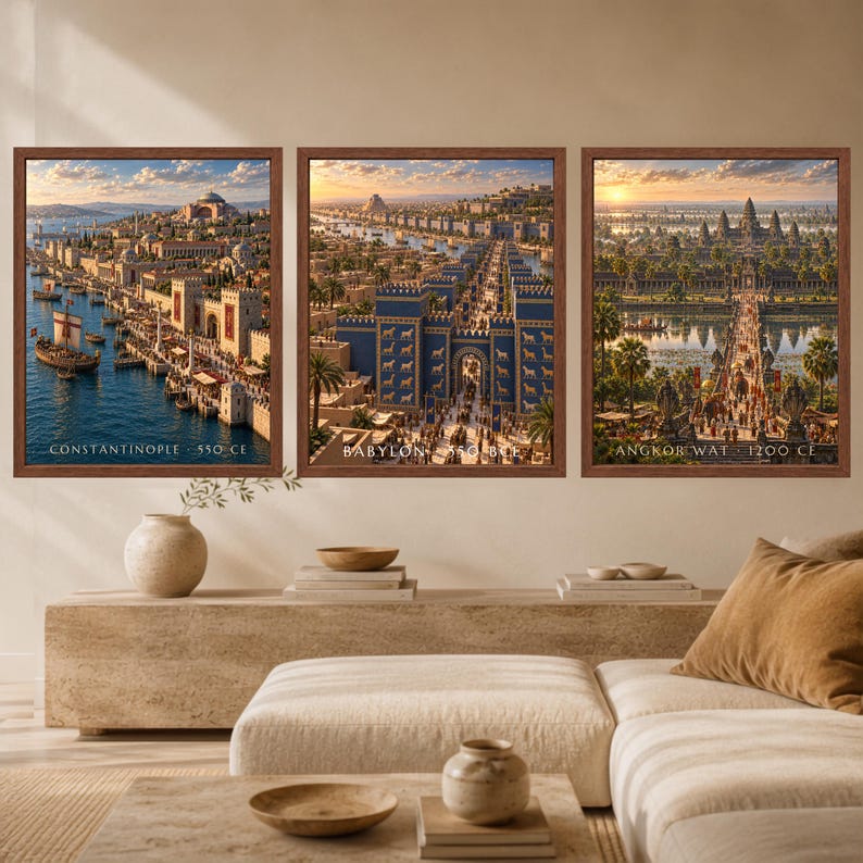 May include: Three framed wall art prints depicting historical cities. The left print shows Constantinople 550 CE with a harbor. The center print shows Babylon 550 BCE with blue gates. The right print shows Angkor Wat 1200 CE with a temple complex.