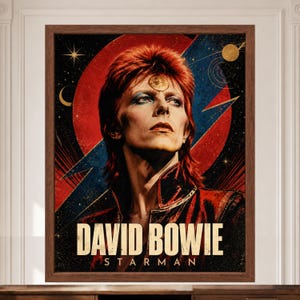 May include: A framed poster featuring a portrait of David Bowie with red hair, set against a background of a large red circle and a blue lightning bolt. The text DAVID BOWIE STARMAN is printed in large, bold, light-colored letters at the bottom.