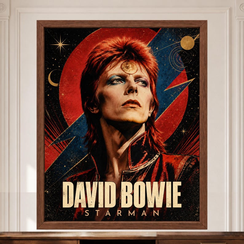May include: A framed poster featuring a portrait of David Bowie with red hair, set against a background of a large red circle and a blue lightning bolt. The text DAVID BOWIE STARMAN is printed in large, bold, light-colored letters at the bottom.