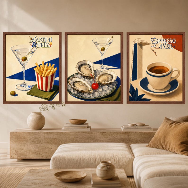 May include: A set of three framed wall art prints. The first shows a martini glass with an olive and a carton of fries with the text Martini & Fries. The second shows oysters on ice and a martini glass. The third shows a coffee cup with the text Espresso Diver.