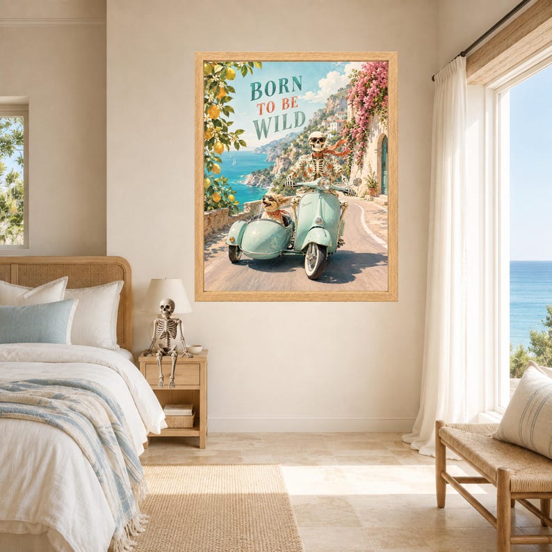 May include: A framed wall art print featuring a skeleton riding a light blue scooter with a sidecar containing a small dog. The scene is set on a coastal road with lemon trees and pink flowers. The text BORN TO BE WILD is printed at the top.