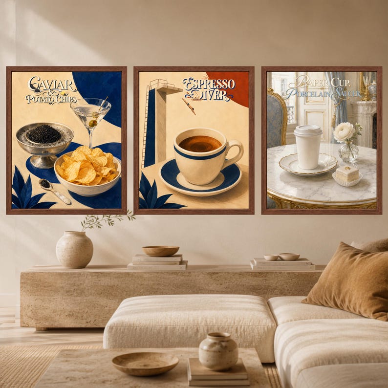 May include: A set of three framed wall art prints. The first shows caviar and potato chips with text reading Caviar & Potato Chips. The second shows an espresso cup and a diving board with text reading Espresso Diver. The third shows a paper cup on a saucer with text reading Paper Cup & Porcelain Saucer.