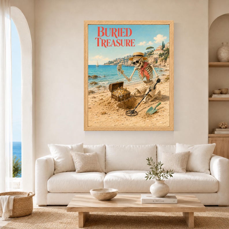 Puede incluir: Una impresi&oacute;n art&iacute;stica enmarcada titulada BURIED TREASURE que muestra un esqueleto con sombrero de paja, gafas de sol y una bufanda roja en una playa. El esqueleto sostiene un collar de perlas junto a un cofre del tesoro abierto y un detector.