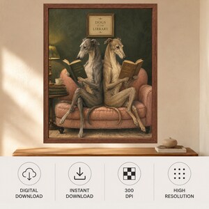 May include: A framed wall art print titled DOGS AT THE LIBRARY featuring two greyhounds sitting back-to-back on a pink sofa, each reading a book. The scene includes a dark green wall, a side table with a lamp and a teacup, and a framed sign above.