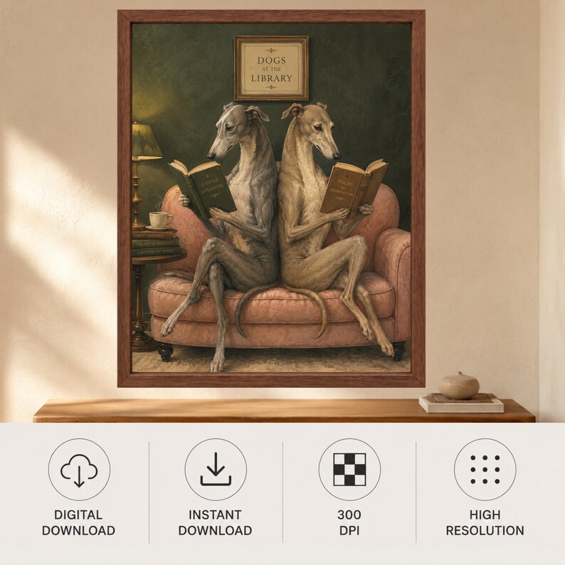 May include: A framed wall art print titled DOGS AT THE LIBRARY featuring two greyhounds sitting back-to-back on a pink sofa, each reading a book. The scene includes a dark green wall, a side table with a lamp and a teacup, and a framed sign above.