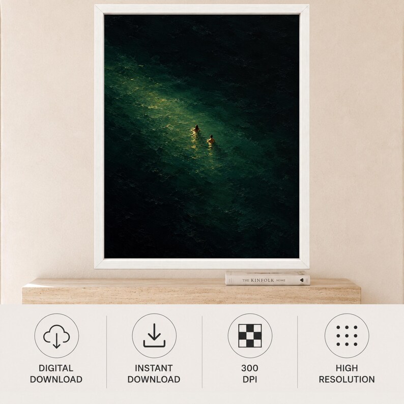 May include: A framed wall art print featuring a dark, deep green ocean scene with two small figures swimming in a bright, narrow shaft of light that cuts diagonally across the water, creating a high-contrast visual of light and shadow.