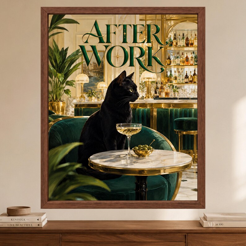 May include: A framed wall art print titled AFTER WORK featuring a black cat sitting on a dark green velvet chair at a small marble table. On the table sits a cocktail glass and a small bowl of green olives, set against a bar background.