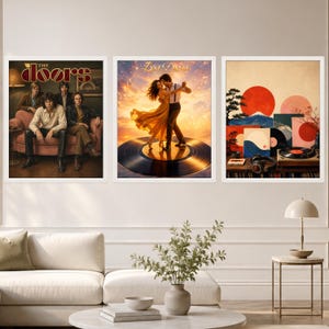 May include: Three framed wall art prints. The left print shows the band The Doors sitting on a sofa. The center print depicts a couple dancing on a vinyl record against a sunset. The right print features a stylized landscape with a red sun.