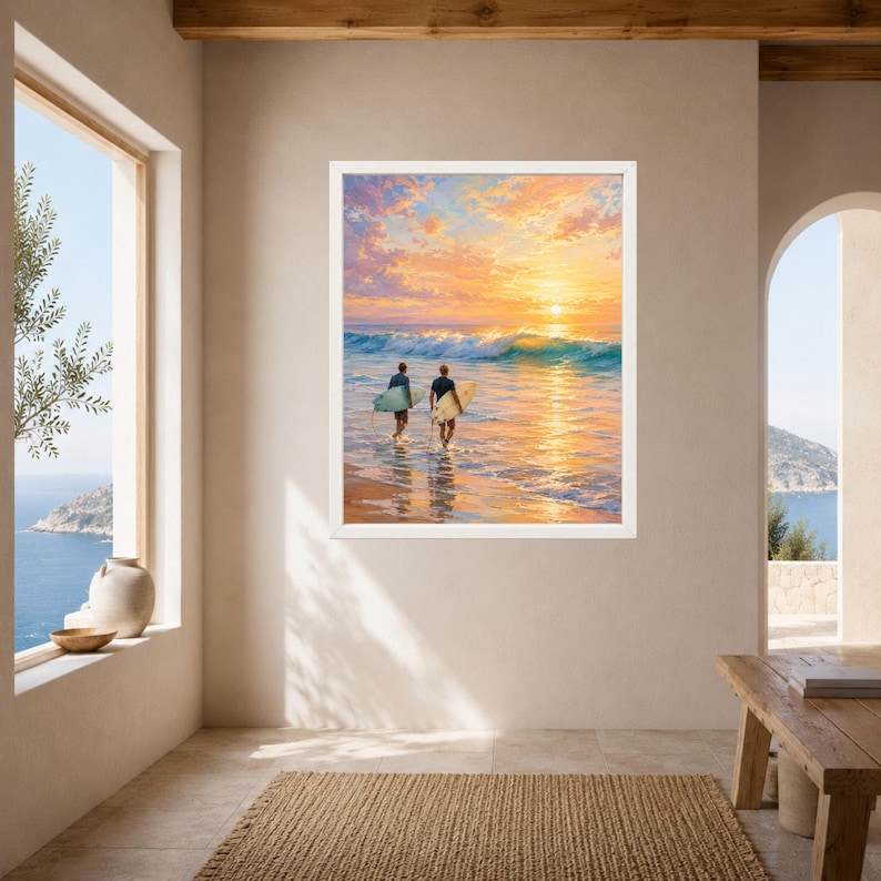 May include: A framed wall art print depicting two individuals carrying surfboards while walking into the ocean at sunset. The scene features golden orange clouds, a bright sun on the horizon, and turquoise waves crashing against the sandy shore.