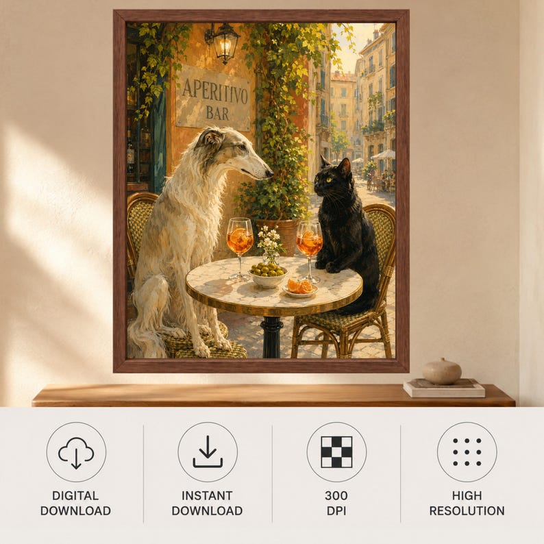 May include: A framed wall art print depicting a white Borzoi dog and a black cat sitting on wicker chairs at a round table. On the table are two glasses of orange Aperol spritz, a small bowl of green olives, and a plate of orange slices.