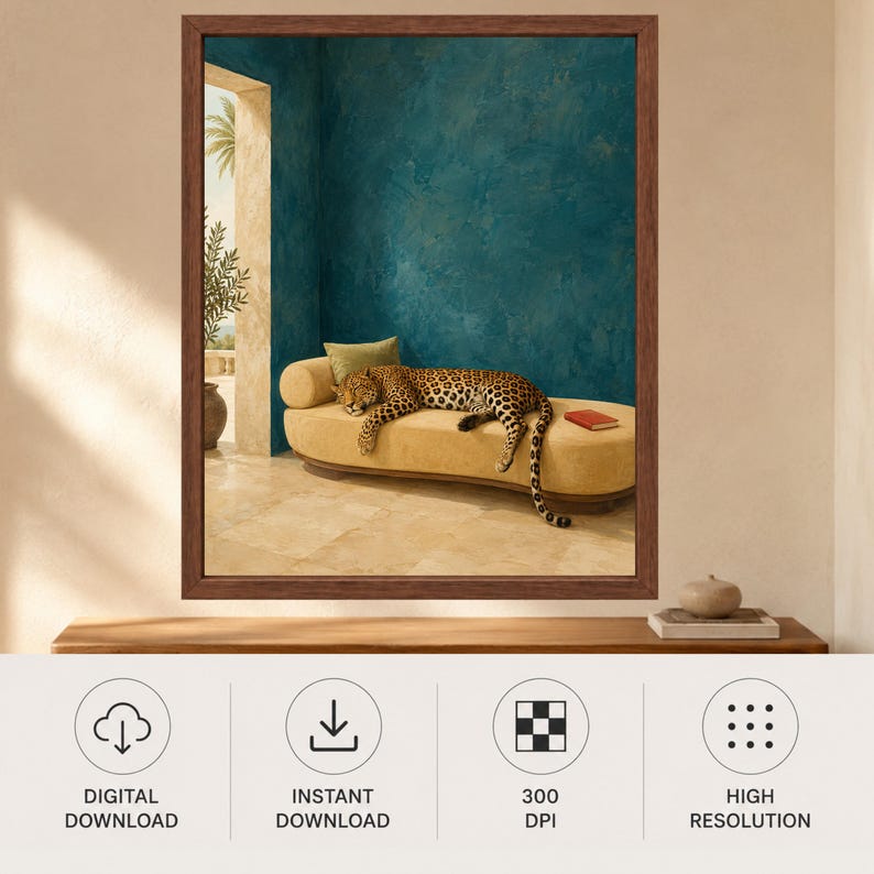 May include: A framed wall art print featuring a leopard resting on a beige curved chaise lounge against a textured teal wall. The scene includes a stone floor, a potted plant in an arched doorway, and a small red book on the lounge cushion.