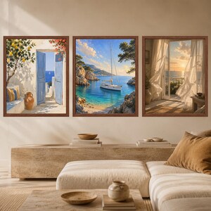 May include: A set of three framed wall art prints featuring coastal scenes. The left print shows a lemon tree and blue doors, the center print depicts a sailboat in a turquoise bay, and the right print displays a sunlit window with sheer curtains.
