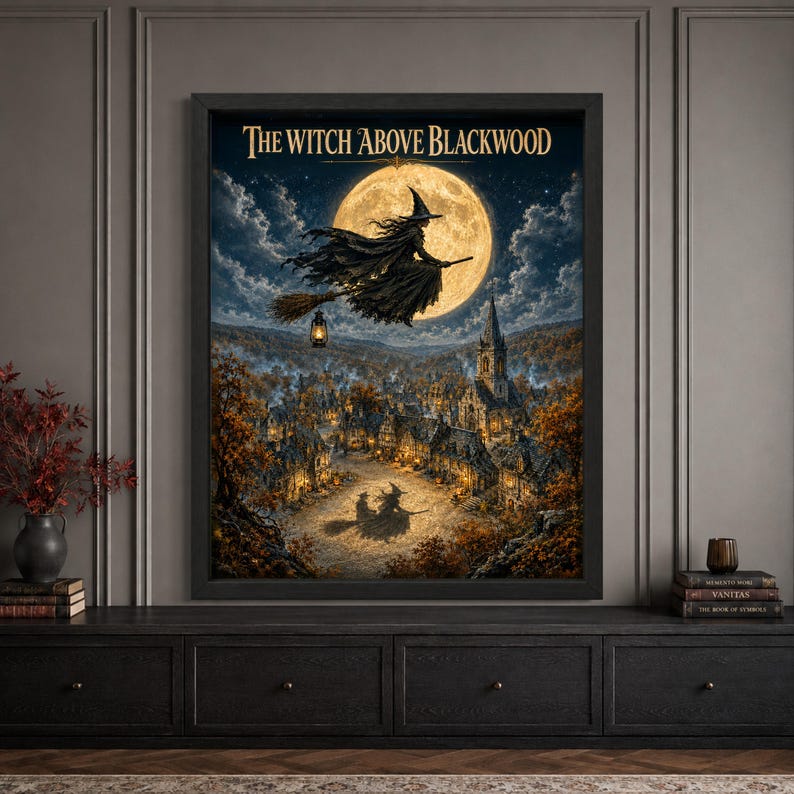 Framed flying witch Halloween wall art featuring a witch on a broom silhouetted against a huge full moon above an autumn village, glowing church and houses, with vintage “The Witch Above Blackwood” typography.