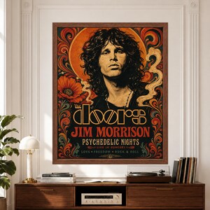 Framed The Doors and Jim Morrison wall art featuring a vintage psychedelic rock portrait surrounded by ornate orange, teal and cream graphics, floral forms and smoke-like details with bold The Doors, Jim Morrison and Psychedelic Nights typography above a record player console.