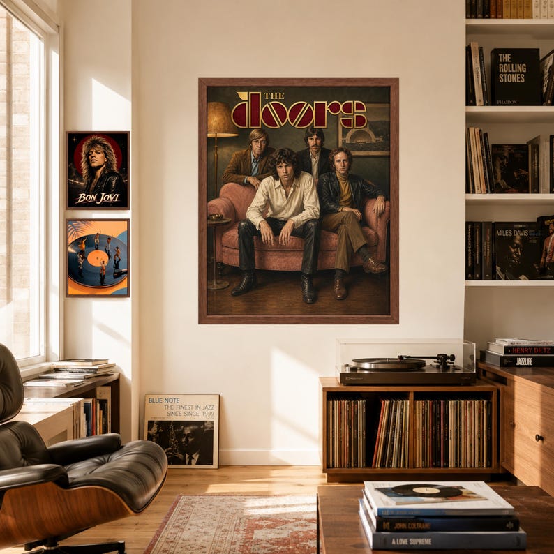 May include: A framed wall poster featuring the band The Doors sitting on a pink sofa, with the band name in stylized gold lettering at the top. Two smaller framed posters are displayed to the left, one showing Bon Jovi and one showing a vinyl record.