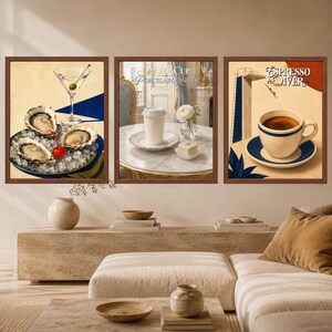 May include: A set of three framed wall art prints. The left print shows oysters on ice with a martini. The center print features a paper cup on a porcelain saucer with the text Paper Cup Porcelain Saucer. The right print shows coffee with the text Espresso Diver.