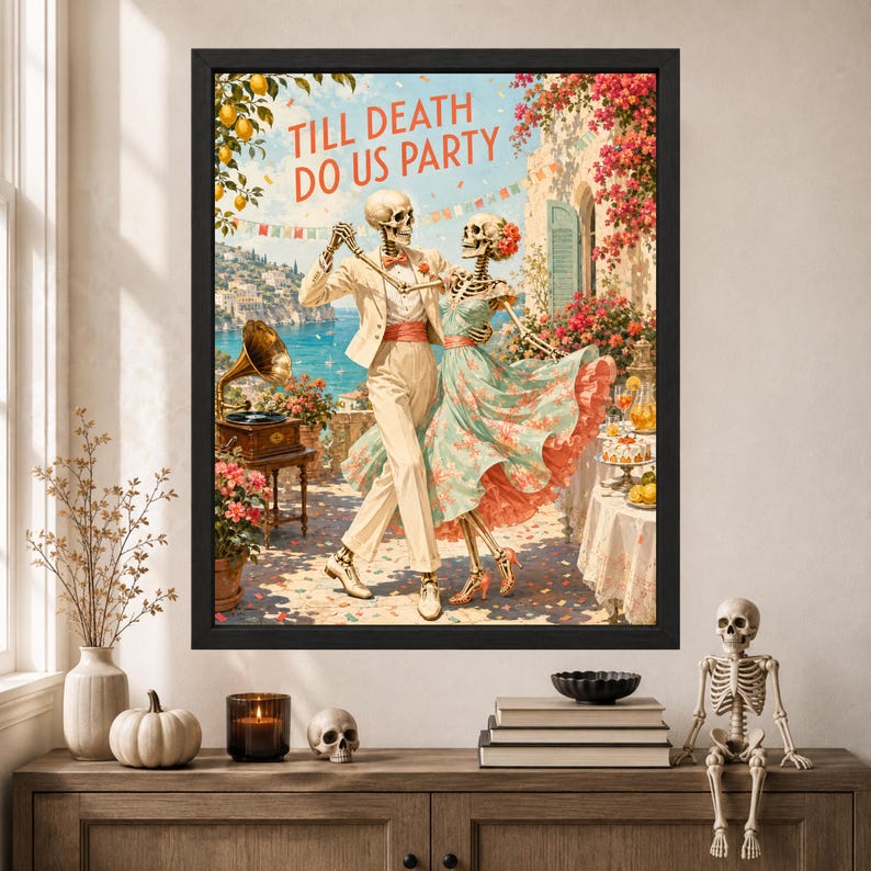 May include: A framed wall art print featuring two skeletons dancing on a terrace overlooking the sea. The text TILL DEATH DO US PARTY is printed at the top. The skeletons wear a cream suit and a floral dress. A gramophone and table are visible.