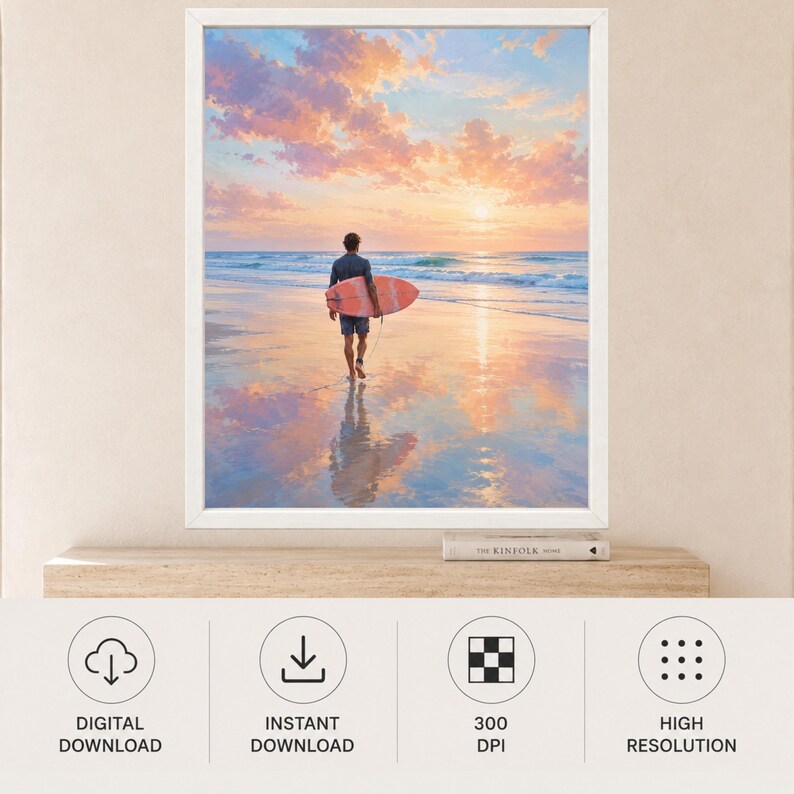 May include: A framed wall art print featuring a person walking on a wet sandy beach at sunset while carrying a surfboard. The sky is filled with soft pink and orange clouds, and the ocean waves are visible in the distance under the bright sun.