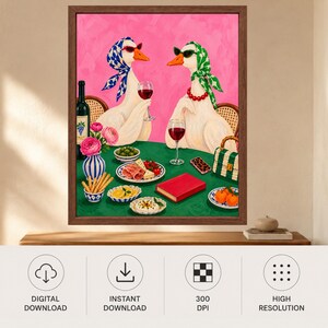 May include: A framed wall art print featuring two white geese wearing headscarves and sunglasses, sitting at a green table with wine glasses, a bottle of wine, a vase of pink flowers, breadsticks, olives, cheese, fruit, and a red book.