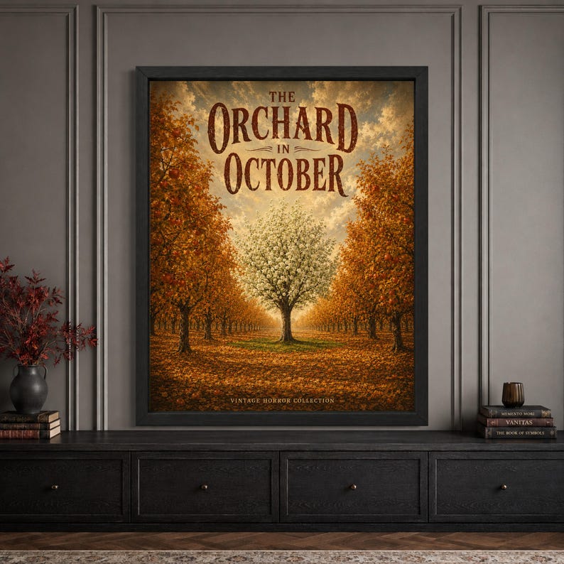 Framed vintage autumn orchard wall art featuring rows of orange fruit trees surrounding a single pale flowering tree, with golden fallen leaves, warm October sky and distressed “The Orchard in October” typography.