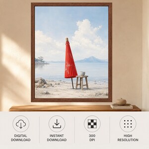 May include: A framed wall art print featuring a closed red Japanese paper umbrella standing upright on a sandy beach next to a small wooden stool, with a calm body of water, distant mountains, and a blue sky with white clouds in the background.