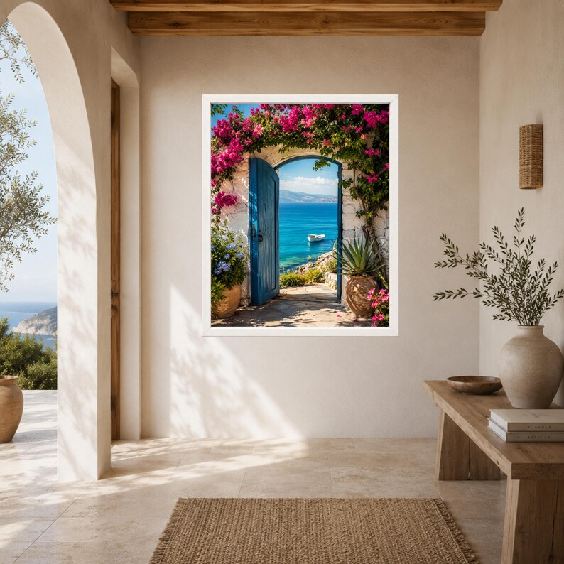 May include: A framed wall art print depicting an open blue door leading to a Mediterranean coastal scene. The doorway is framed by vibrant pink bougainvillea flowers, with a small white boat visible on the blue sea under a clear sky.