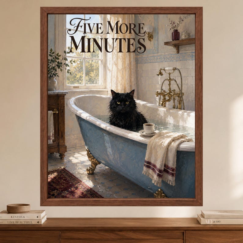 May include: A framed wall art print featuring a black cat sitting in a blue clawfoot bathtub filled with water. The text "FIVE MORE MINUTES" is printed at the top. A white teacup sits on the edge of the tub next to a draped white towel.
