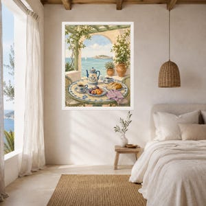 May include: A framed wall art print depicting a Mediterranean terrace scene with a round tiled table, a blue and white teapot, cups, fresh figs, and bread. The background shows a coastal view with a pergola, climbing vines, and a calm blue sea.