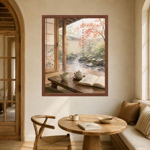 May include: A framed wall art print depicting a rainy Japanese garden scene viewed from a wooden porch. The image shows a low wooden table with a ceramic teapot, a teacup, and an open book, set against a backdrop of wet stones and red maple leaves.