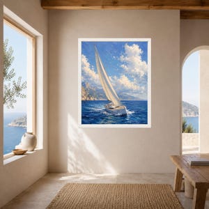 May include: A framed wall art print featuring a white sailboat with a large sail navigating deep blue ocean waters under a bright sky with fluffy white clouds, with distant rocky mountains visible on the horizon in a realistic painting style.