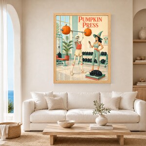 May include: A framed wall art print titled PUMPKIN PRESS featuring a skeleton lifting a barbell with pumpkins on each end, standing next to a person in a witch hat and athletic wear, with a black cat resting on a stack of mats in a gym setting.