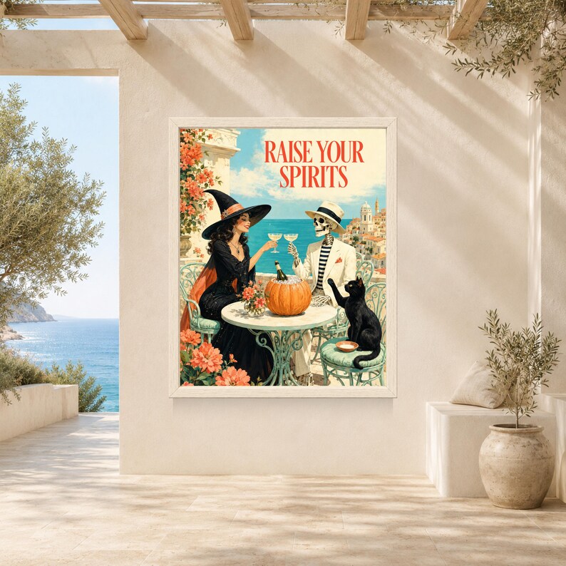 May include: A rectangular wall art print featuring a witch in a black dress and hat and a skeleton in a white suit and hat sitting at a table with a pumpkin and drinks. The text RAISE YOUR SPIRITS is printed in red at the top against a coastal background.