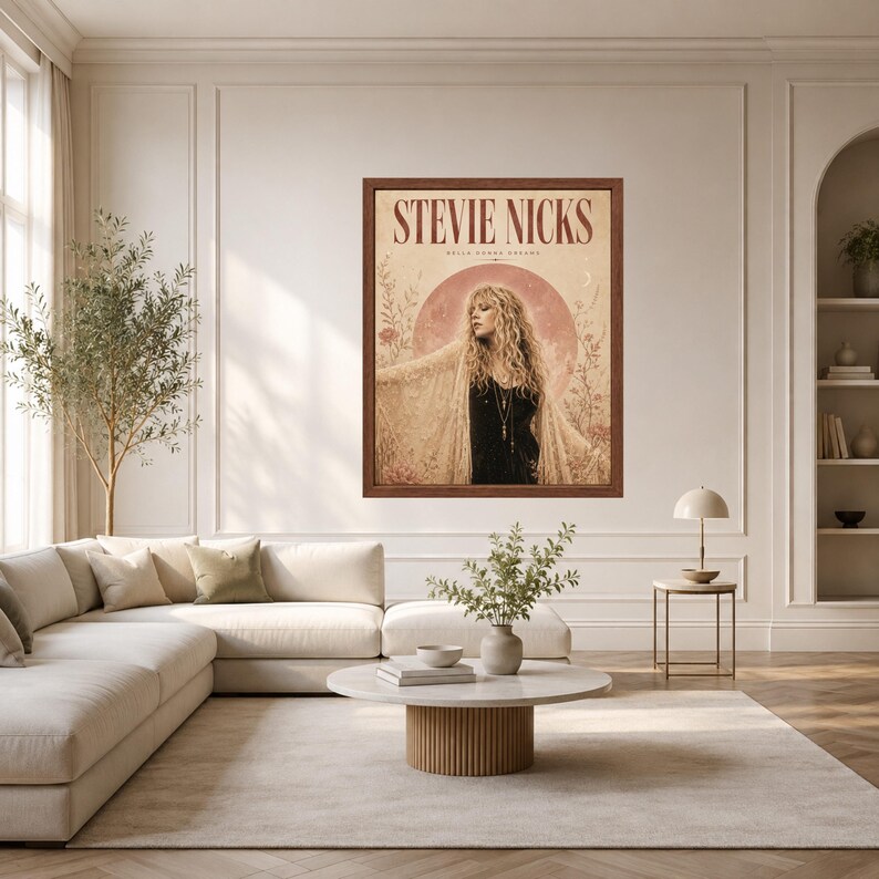 May include: A framed wall art print featuring a portrait of Stevie Nicks with long blonde hair, wearing a black top and a lace shawl. The background includes a large moon, floral illustrations, and the text STEVIE NICKS in a dark red font.