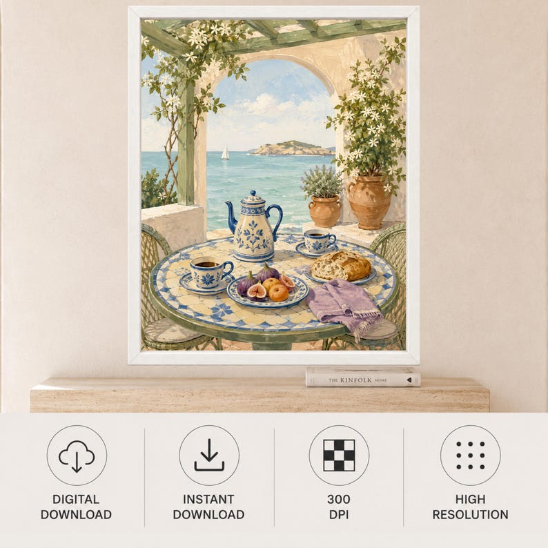 May include: A framed print depicting a Mediterranean terrace with a tiled table, a blue and white teapot, two cups of coffee, a plate of figs, and a loaf of bread. The scene overlooks a blue sea with a distant island under a bright sky.