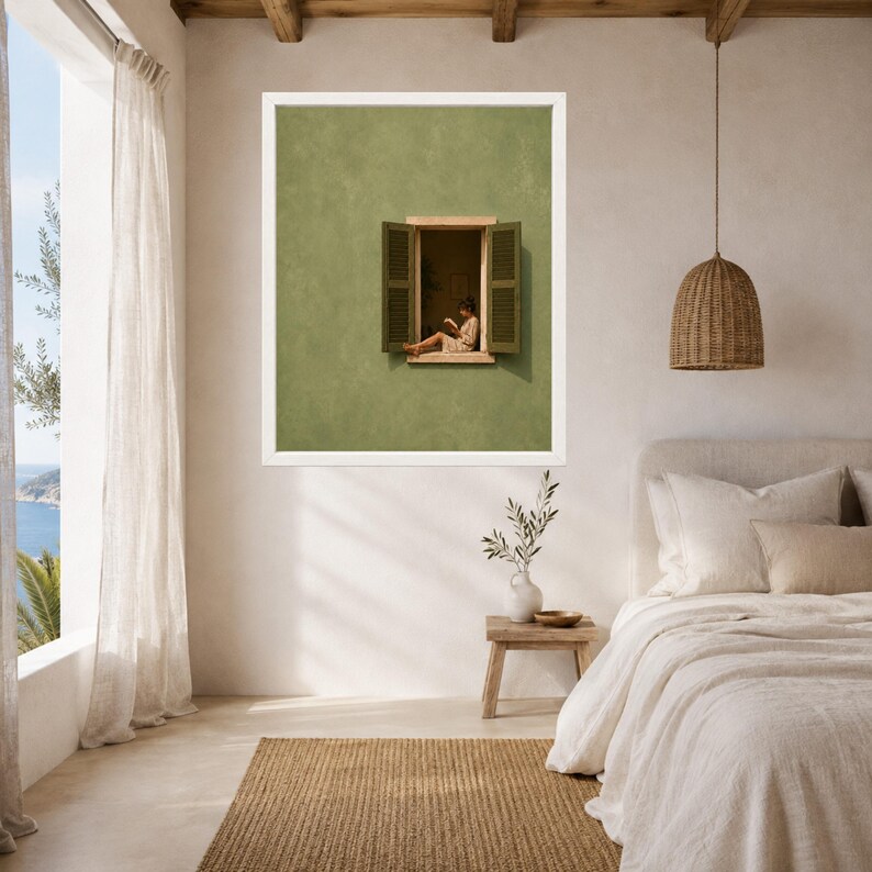 May include: A framed wall art print featuring a solid sage green wall with an open window. Inside the window frame, a person sits on the ledge reading a book. The window has two open shutters on either side, creating a focal point on the wall.