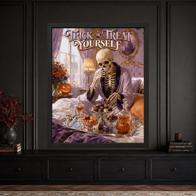 Framed funny Halloween wall art showing a skeleton in a purple robe sitting on an ornate bed with chocolates, candy corn, a silver tray and jack-o’-lantern beneath Trick or Treat Yourself lettering.