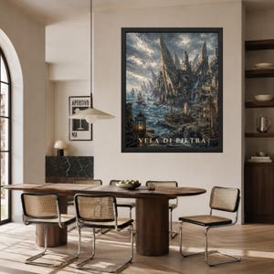 May include: A framed rectangular wall art print titled VELA DI PIETRA Harbor of the Seven Sails, depicting a dark, intricate coastal city with towering stone spires, jagged cliffs, and sailing ships on a turbulent sea under a cloudy sky.