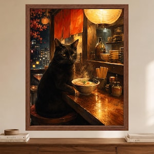 May include: A framed wall art print depicting a black cat sitting on a stool at a wooden counter in a dimly lit restaurant. A bowl of steaming ramen with an egg sits on the counter next to a container of chopsticks and various condiment bottles.