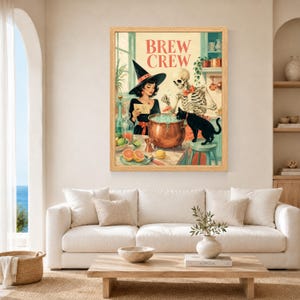 May include: A framed wall art print titled BREW CREW featuring a witch in a black hat, a skeleton wearing a red bowtie, and a black cat gathered around a copper cauldron. The scene includes citrus fruits, glassware, and kitchen shelves.