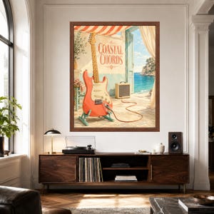 May include: A framed wall art print featuring a coral-coloured electric guitar on a stand, connected by a cable to a small amplifier. The scene depicts a coastal terrace with the text Coastal Chords on a wall, overlooking a blue sea and sky.