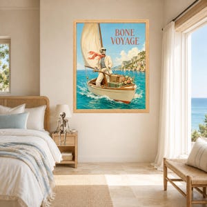 May include: A framed wall art print featuring a skeleton wearing sunglasses, a striped shirt, and a light-colored suit, sailing a small boat on blue water. The text BONE VOYAGE is printed at the top. The scene includes luggage and flowers.